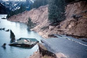Photo of house submerged into water and highway 287 slumped into lake as a result of the Hebegen Earthquake also known as the Yellowstone Earthquake.