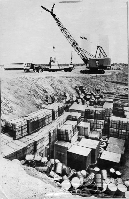 Crane loading material on a truck