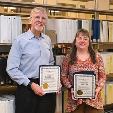 Todd Steben and Lenee Otto from the Washington Lottery Commission accept their award